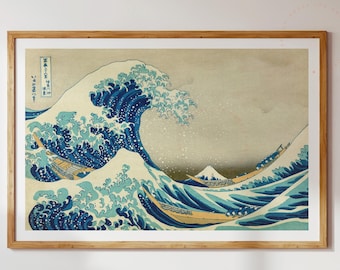 May include: A framed print of a famous Japanese woodblock print depicting a large wave crashing over three boats. The wave is blue and white with splashes of green and yellow. The background is a light beige with a hint of blue. The print is titled "The Great Wave off Kanagawa" in Japanese characters.