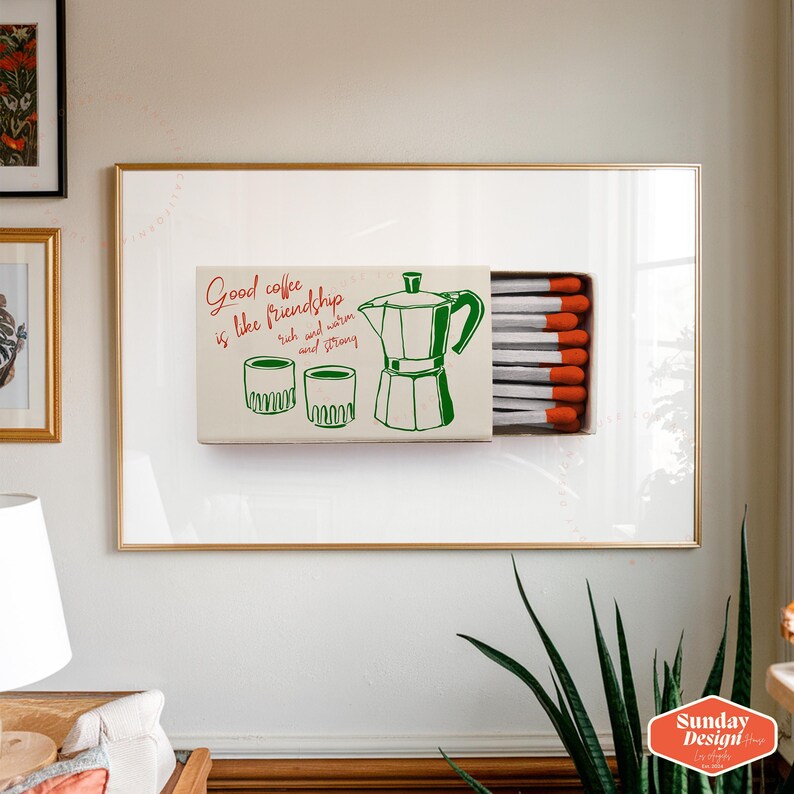 May include: A framed print with a green and red illustration of a coffee pot and two cups. The print says "Good coffee is like friendship, rich and warm and strong".
