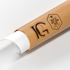 May include: A rolled-up poster in a brown paper tube with a gold band. The poster is partially unrolled, revealing white paper. The tube has a black logo and a promotional sticker that reads "BUY 3+ GET 30% OFF".