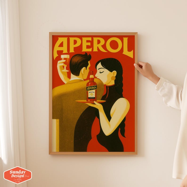 May include: A vintage style poster with the text 'Aperol' in yellow letters on a red background. The poster features a man and a woman holding a bottle of Aperol and a glass of Aperol. The woman is wearing a black dress and the man is wearing a brown suit.