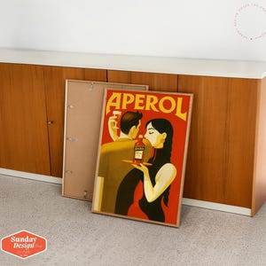 May include: A vintage poster advertising Aperol, featuring a couple in a romantic setting. The poster has a red background with the word "Aperol" in white letters. The couple is dressed in stylish clothing and is holding a bottle of Aperol.