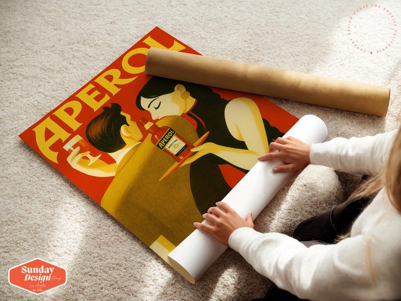 May include: A vintage-style poster advertising Aperol, a popular Italian liqueur. The poster features a couple embracing, with the woman holding a bottle of Aperol. The text "Aperol" is prominently displayed in a yellow font.