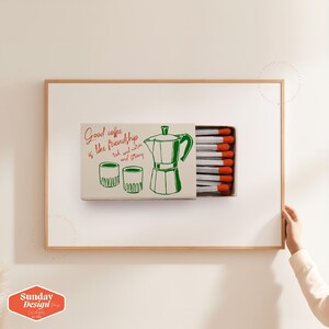 May include: A white matchbox with a green illustration of a coffee pot and two cups. The text on the matchbox reads "Good coffee is like friendship - rich and warm and strong".
