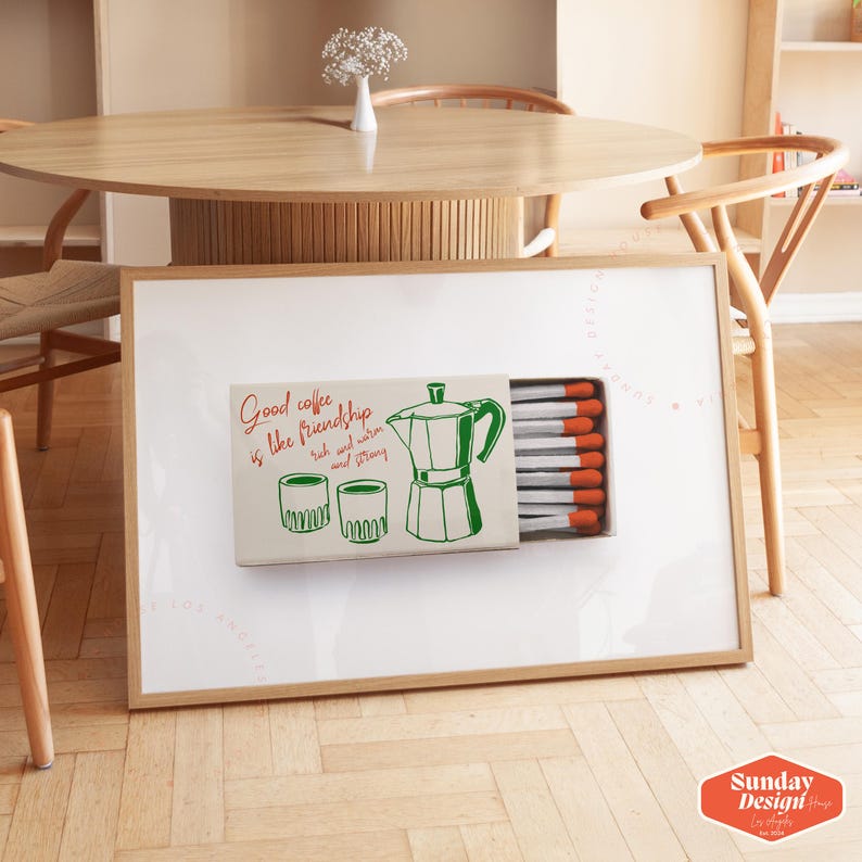 May include: A white framed picture with a green and white illustration of a coffee pot, two cups, and a box of matches. The text on the picture reads "Good coffee is like friendship, rich and warm and strong."