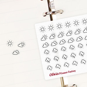 May include: A sheet of weather stickers with various icons for sunny, cloudy, rainy, and stormy days. The stickers are white with black outlines and are arranged in a grid pattern. The sheet is labeled "Olivia Planner Factory C137".