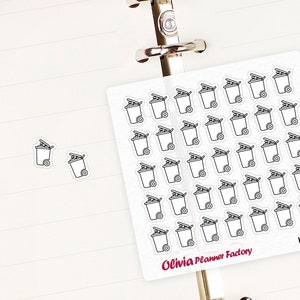 May include: A sheet of stickers with a white background and black outlines of trash cans. The stickers are arranged in a grid pattern and are labeled "Olivia Planner Factory" and "L143".