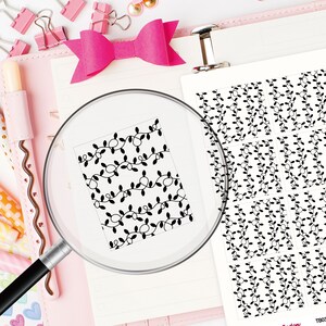 May include: A sheet of printable stickers featuring a repeating pattern of black fairy lights with leaves. The stickers are designed for use in planners and journals.