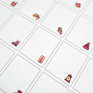 May include: A white grid with dotted lines, featuring colorful illustrations of seasonal items. Images include a jar of jam, an acorn, a glove, a boot, a thermometer, a beanie, a lantern, and a leaf. The illustrations are in a cartoon style.