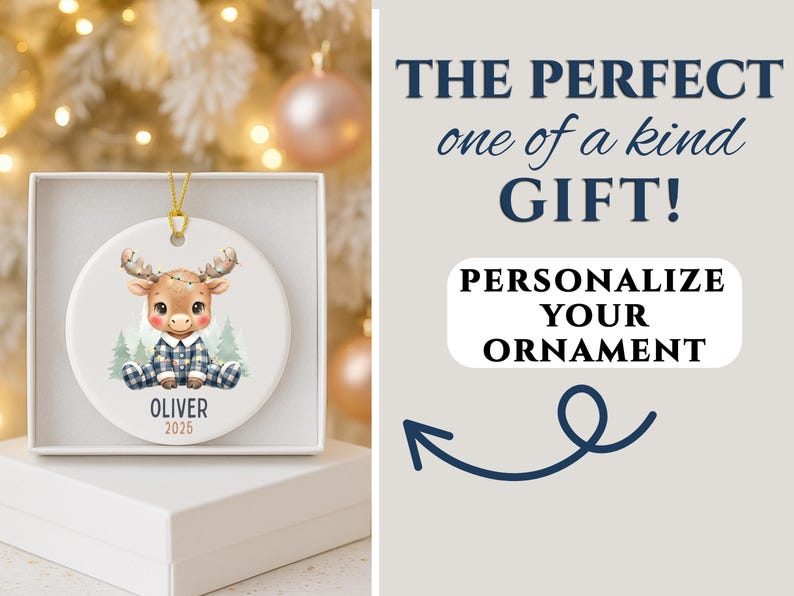 May include: A personalized Christmas ornament featuring a cartoon moose in a blue plaid outfit, sitting in front of pine trees. The ornament is white, with the name "Oliver" and the year "2025" printed on it. The text "The perfect one of a kind GIFT!" is also visible.