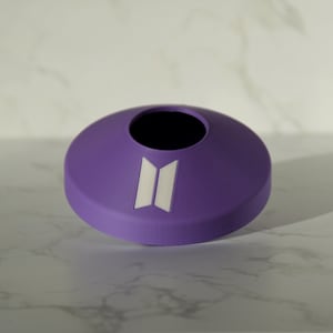 May include: Purple plastic container with a round opening and a white "BTS" logo.