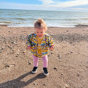 Childrens Bonjour Bébé Jacket. Sustainable, handmade, unisex, fun, festival, kids, co-ord top. Baby child size. in Rainbows print. image 10