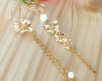 Asymmetrical "Vanda" earrings with orchid, gold chains and white jade beads. Long and delicate earrings.