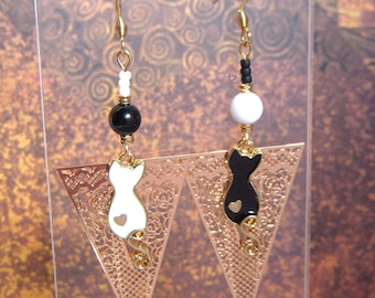 Mismatched asymmetrical cat earrings in black and white. Original women's gift. Long dangling enamel earrings.