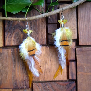 Long multi-colored feather earrings. Original earring in natural feathers. Boho chic earring.