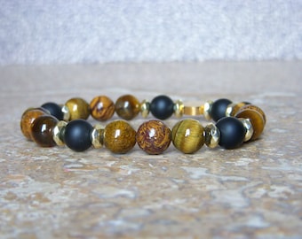Women's bracelet in matte Onyx, Tiger's Eye and Elephant Skin Jasper. Bracelet in golden pearls and 8mm natural stones.