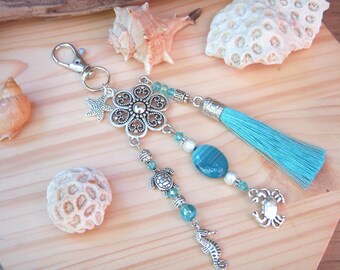 Turquoise blue and silver bag charm or key ring with agate bead and crab, seahorse and starfish charm.