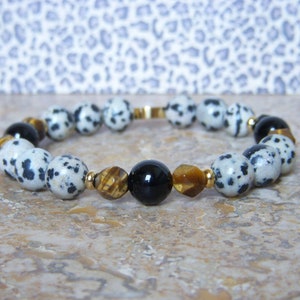 Women&#39;s bracelet in Onyx, Tiger&#39;s Eye and Dalmatian Jasper and golden stainless steel beads. 8mm beads. Trendy women&#39;s gift.