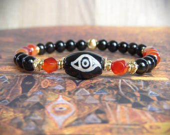 Women's lucky bracelet made of natural stone and Nepalese dzi beads. An original Mother's Day gift. A bracelet with a protective eye.
