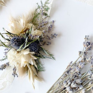 Thistle, white and neutral corsages