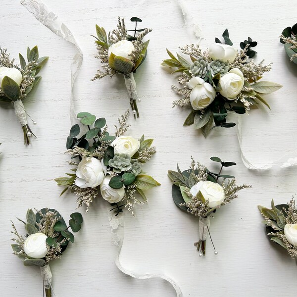 White ranunculus and greenery boutonnieres/corsages