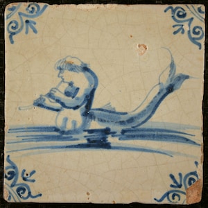 Fine Antique Delft tile with a flute playing mythical sea creature 17e eeuw