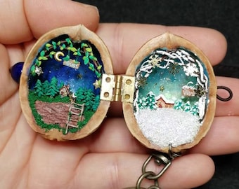 Casa de muñecas en miniatura de cáscara de nogal, escena invernal hecha a mano