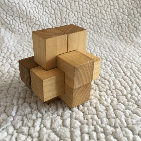 Wood brain teaser burr puzzle, hand sanded, and hand finished for fun and stimulating play.