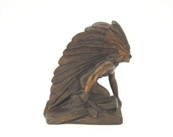 French Art Deco Spelter Statue: Kneeling Indian with Axe.
