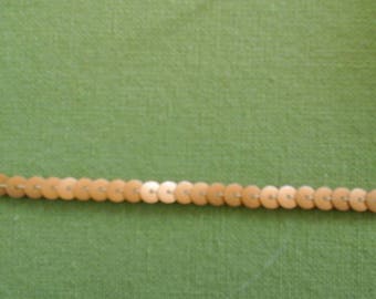 Vintage ribbon of half-centimetre matte gold sequins