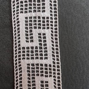 Between two cotton ecru measuring 3.5cm wide and sold per meter