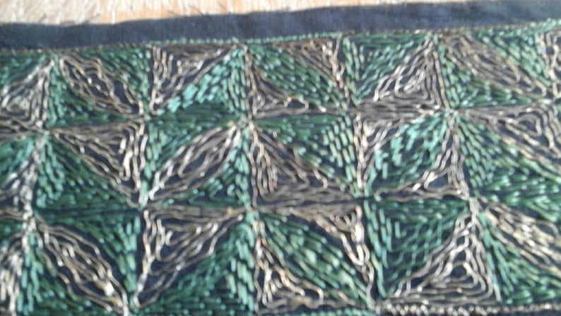 7cm flat galon of wide art deco by its geometric designs an 8 cm black canvas embroidered with green silk and gold metal wire