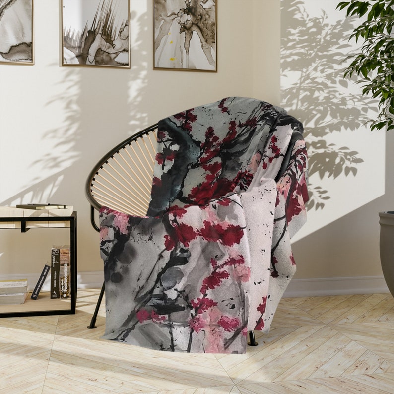 Velveteen Minky Blanket featuring an original Sakura Bloom Art, with gray and pink flowers. This Japan-inspired aesthetic home decor piece adds a touch of elegance to any space, perfect as a bed cover or decorative throw. One sided print.