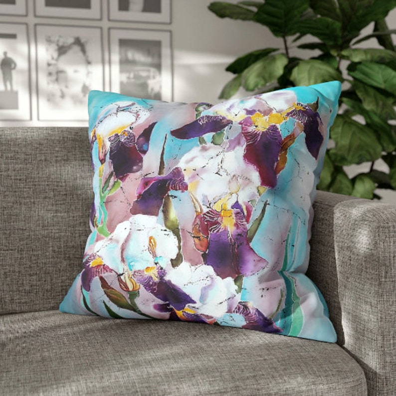 Introduce a touch of nature-inspired elegance to your living space with our Purple Irises Batik Art Pillow Cover. This exquisite piece seamlessly combines the beauty of batik artistry with the vibrant hues of purple irises.