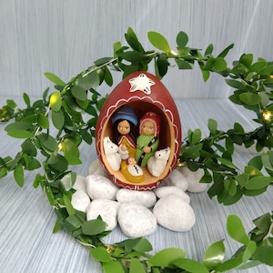 Egg made of clay with small nativity inside. is hand paited and decorative by the indegenous people from peru.
