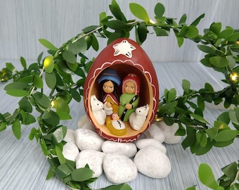 egg made of clay with small nativity inside. is hand paited and decorative by the indegenous people from peru.