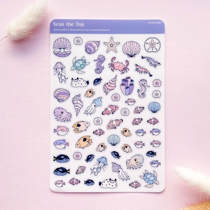 May include: A rectangular sticker sheet titled Seas the Day featuring various marine life illustrations including a pearl in a shell, starfish, sea turtles, seahorses, crabs, jellyfish, octopuses, and assorted fish in shades of purple, blue, and pink.