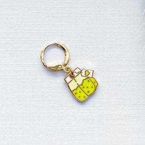 Charm de bolsita de té verde