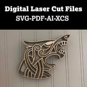 May include: A layered wooden wolf head design, laser cut with intricate details. The artwork features a light wood color with dark gray accents, mounted on a light gray background. Text at the top reads "Digital Laser Cut Files SVG-PDF-AI-XCS".