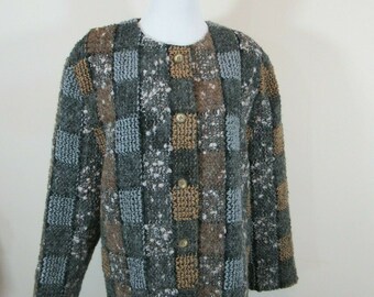 May include: A brown, gray, and beige checkered jacket with a button closure. The jacket has a textured, fuzzy fabric.