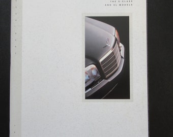 May include: A brochure for Mercedes-Benz S-Class and SL models. The cover features a close-up of the front of a silver Mercedes-Benz car.