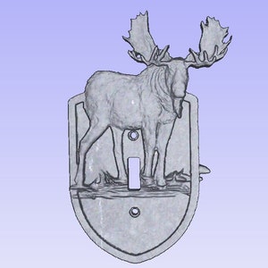 May include: A gray metal light switch cover with a 3D design of a moose standing in a forest. The moose has large antlers and is facing to the right.
