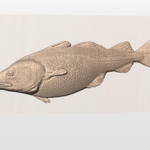 May include: A detailed, three-dimensional carving of a fish, likely a cod, in a light brown hue. The fish is depicted in a side profile, showcasing its textured scales, fins, and a small barbel. The carving is set against a light-colored background.