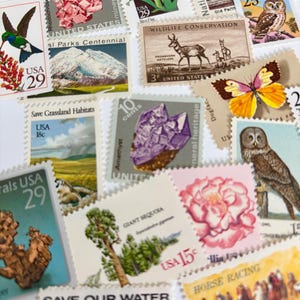 May include: A collection of colorful vintage postage stamps featuring various themes. Stamps depict a hummingbird, flowers, wildlife, minerals, and landscapes. Some stamps have text like "USA 29" and "Wildlife Conservation".