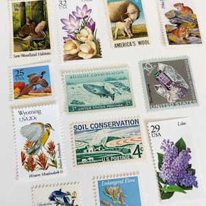 May include: A collection of vintage U.S. postage stamps featuring diverse themes. Stamps depict a butterfly, landscapes, wildlife, flowers, and minerals. Denominations range from 3 to 32 cents, showcasing historical designs and conservation efforts.