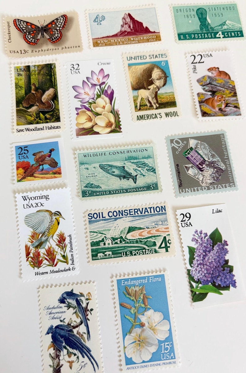 May include: A collection of vintage U.S. postage stamps featuring diverse themes. Stamps depict a butterfly, landscapes, wildlife, flowers, and minerals. Denominations range from 3 to 32 cents, showcasing historical designs and conservation efforts.