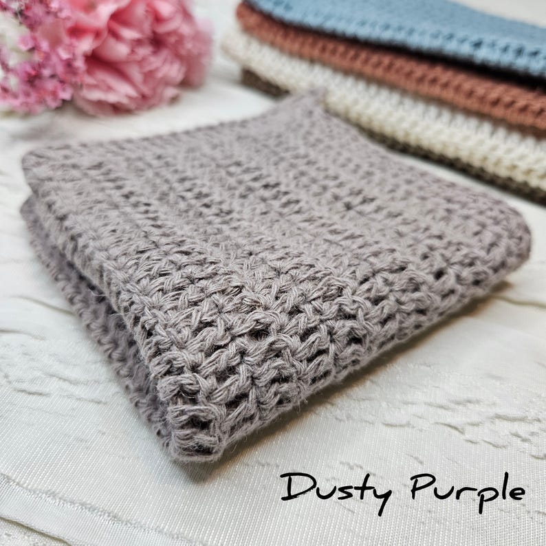 May include: A dusty purple knitted fabric backdrop for photography. The fabric is soft and textured, with a subtle sheen. It is perfect for adding a touch of elegance to your photos.
