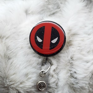 DP Symbol inspired badge reel