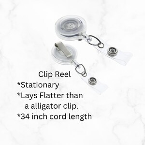 May include: Two clear plastic retractable badge holders with a silver clip and a 34 inch cord. The text on the image reads "Clip Reel *Stationary *Lays Flatter than a alligator clip. *34 inch cord length"