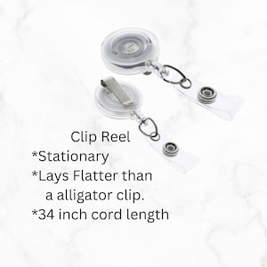 May include: Two clear plastic retractable badge holders with a silver clip and a 34 inch cord. The text on the image reads "Clip Reel *Stationary *Lays Flatter than a alligator clip. *34 inch cord length"