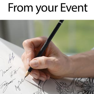May include: A hand holding a black pencil, writing on a white paper with signatures and a decorative drawing. The text "From your Event" is at the top of the image. The background is blurred, with a green and white color scheme.